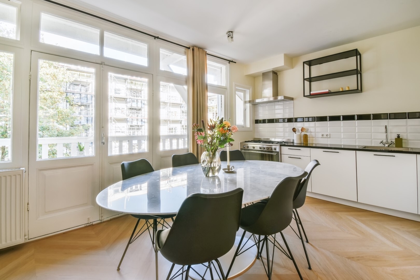 Oval table and black chairs