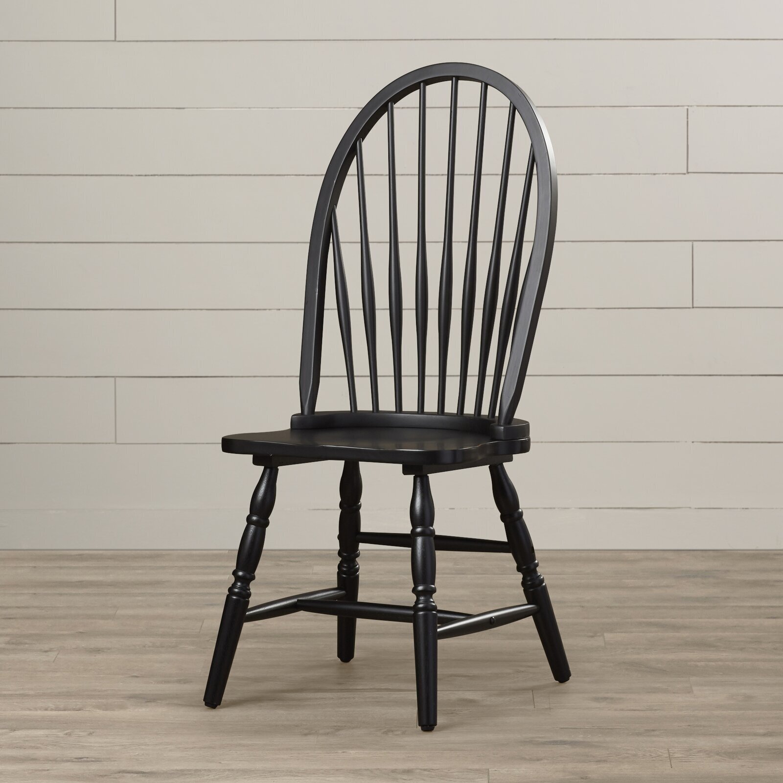 Black Chair With Half Moon Shaped Back