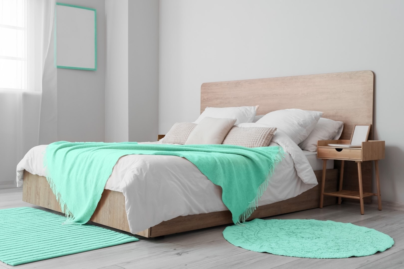 Bed with mint blanket