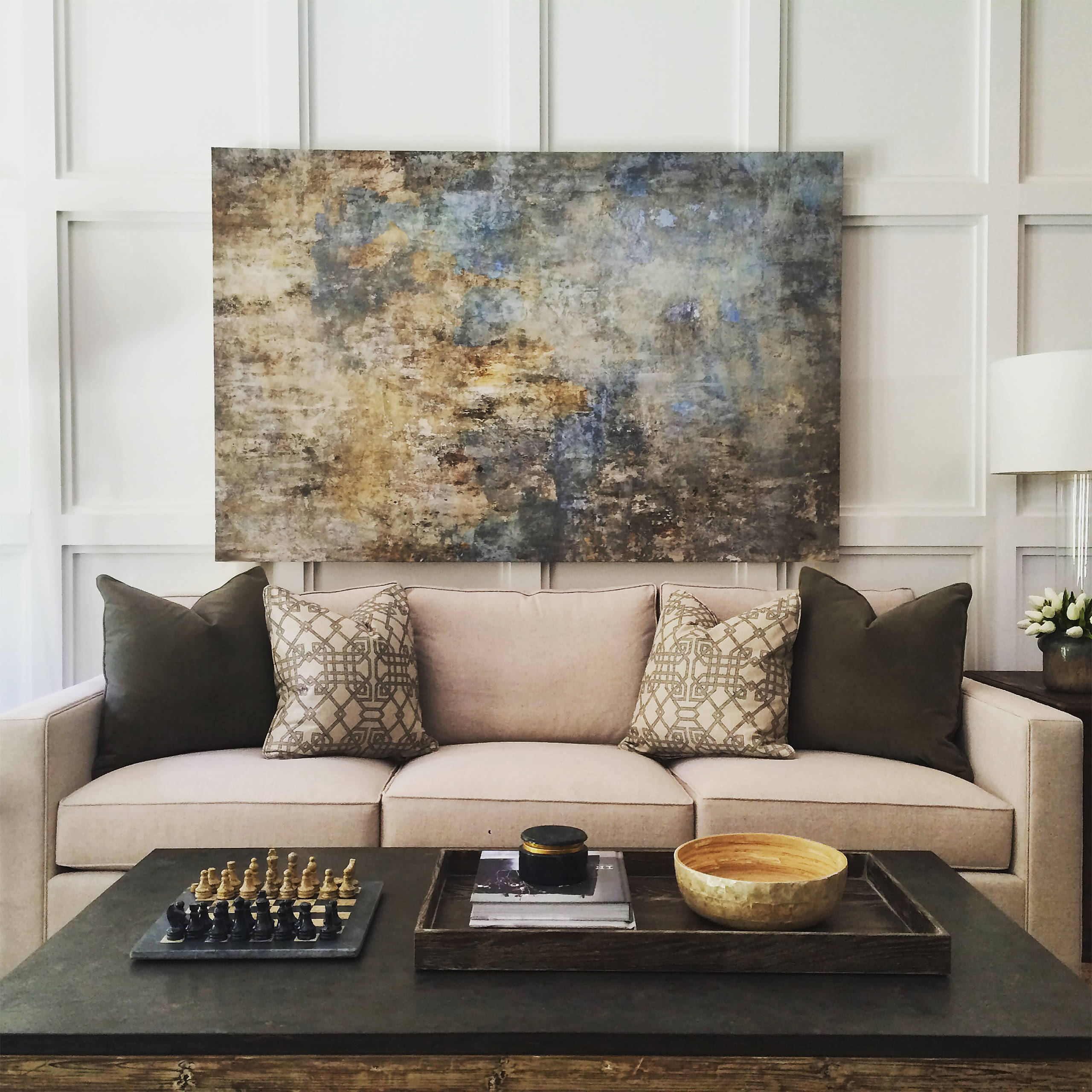 Contemporary living room with wainscotted wall