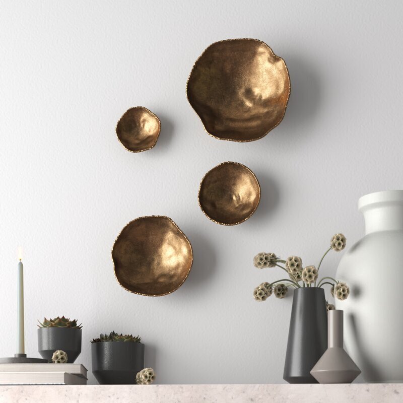 Four piece brass wall ornaments 
