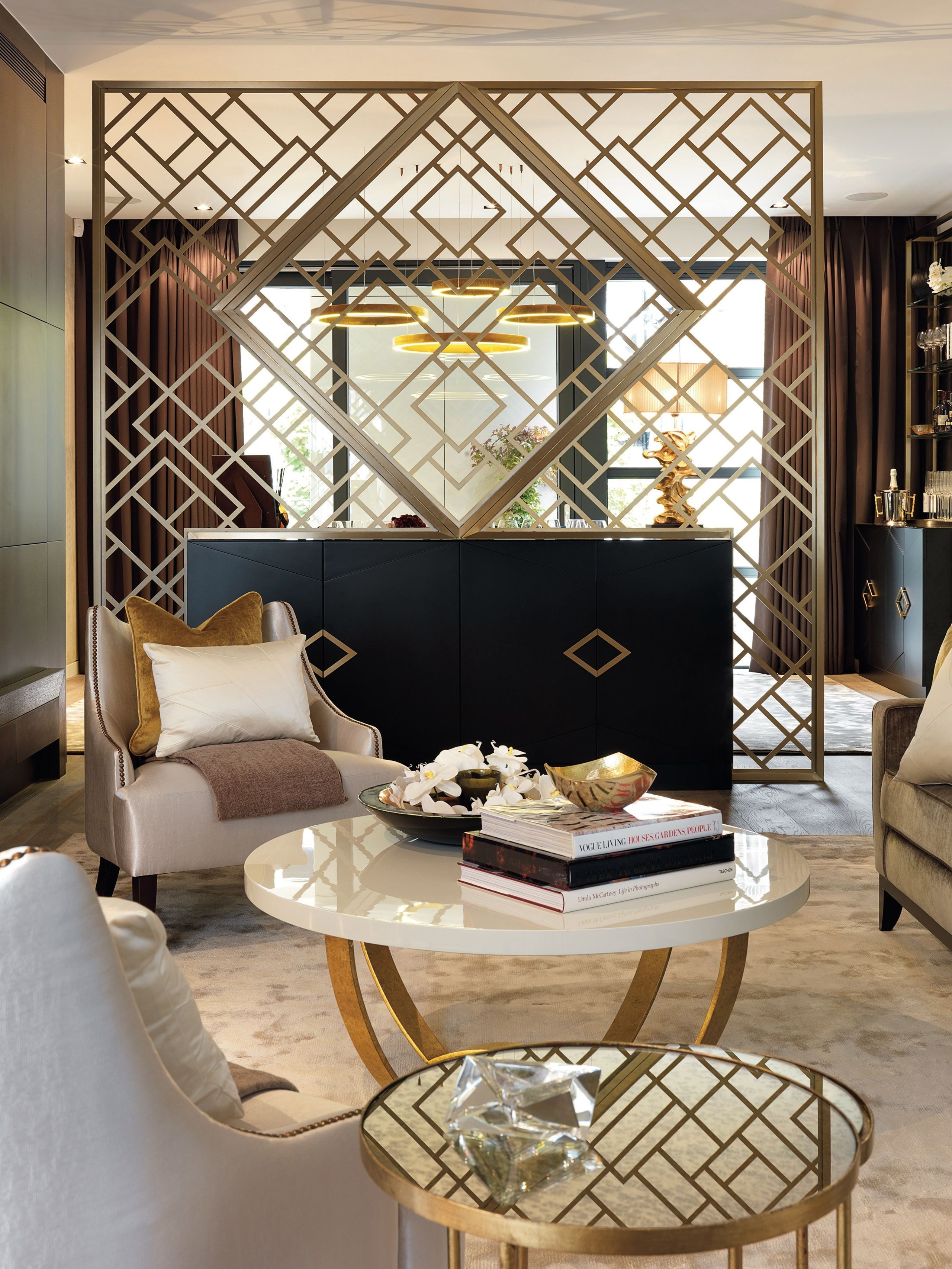 Hollywood regency front room with a divider
