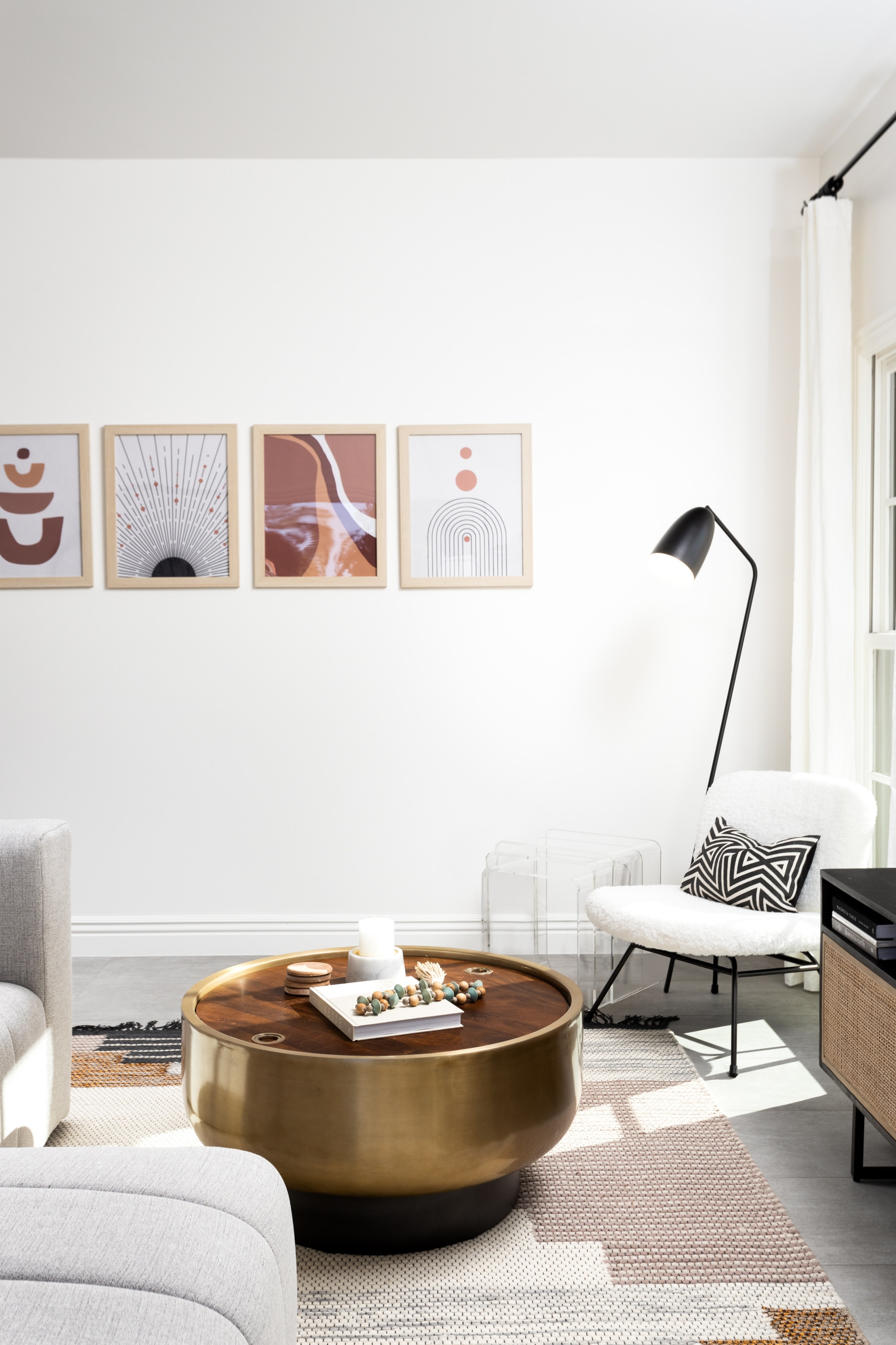 Minimalist bohemian living room with retro brass table