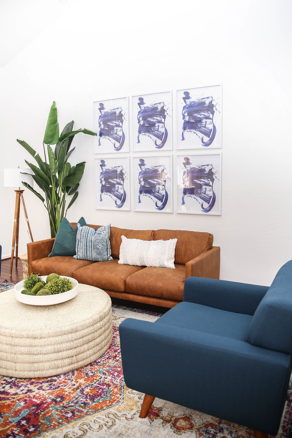 Modern boho living room with print collage on wall