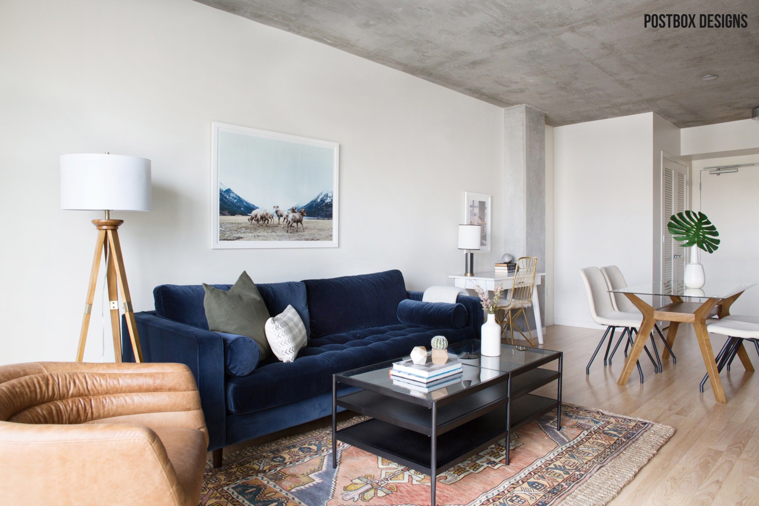 Modern living room with concrete ceiling and bohemian furniture