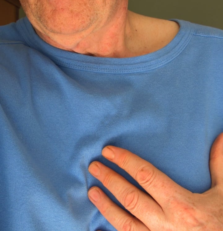 old man feeling a heart attack