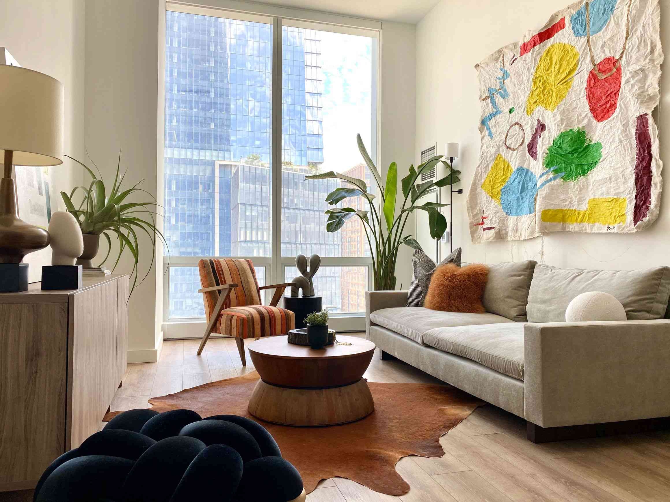Small minimalist bohemian living room in apartment