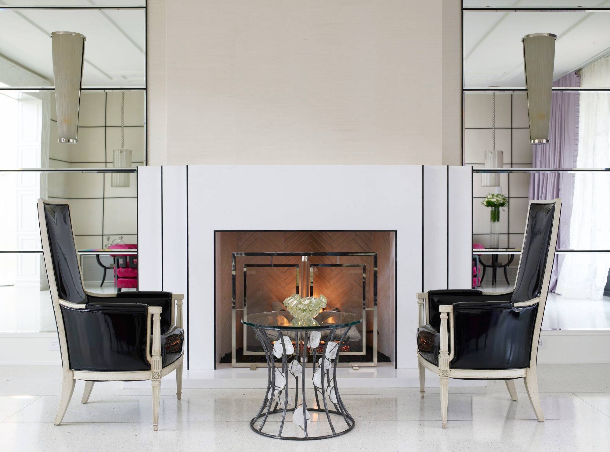 Small seating area next to a fireplace