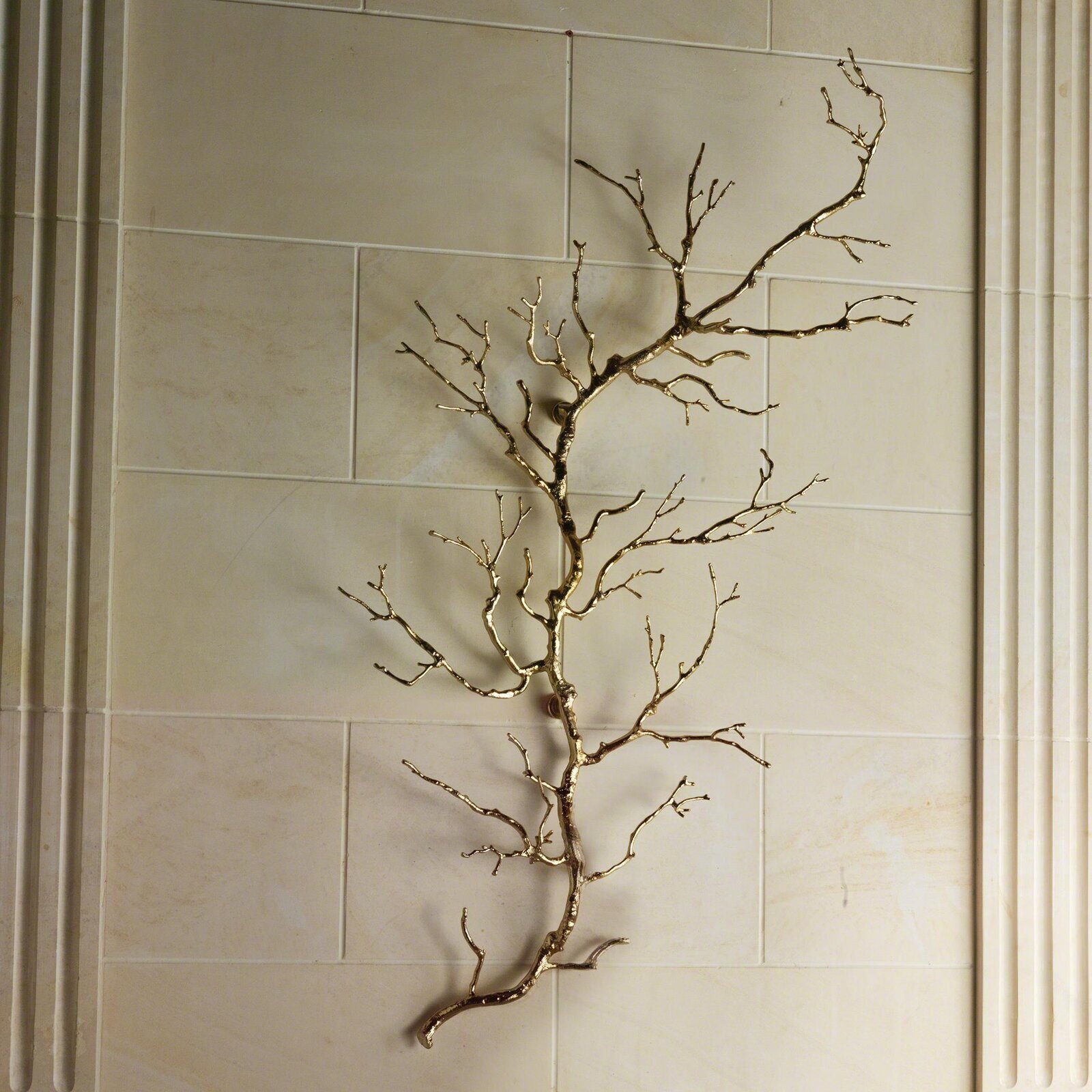 Twig shaped brass wall design 
