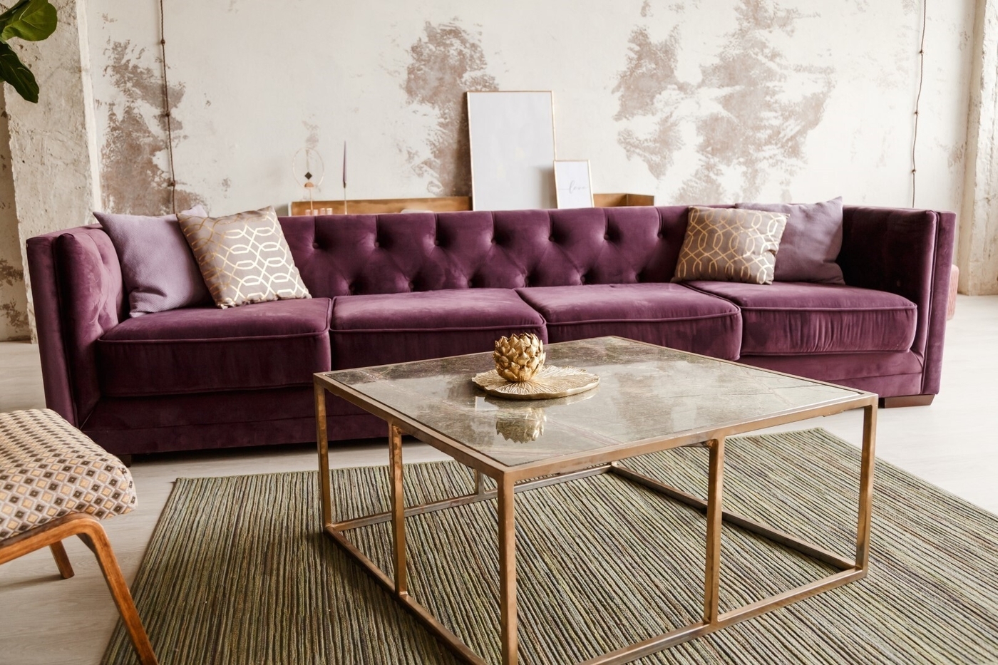Velvet sofa with golden pillow