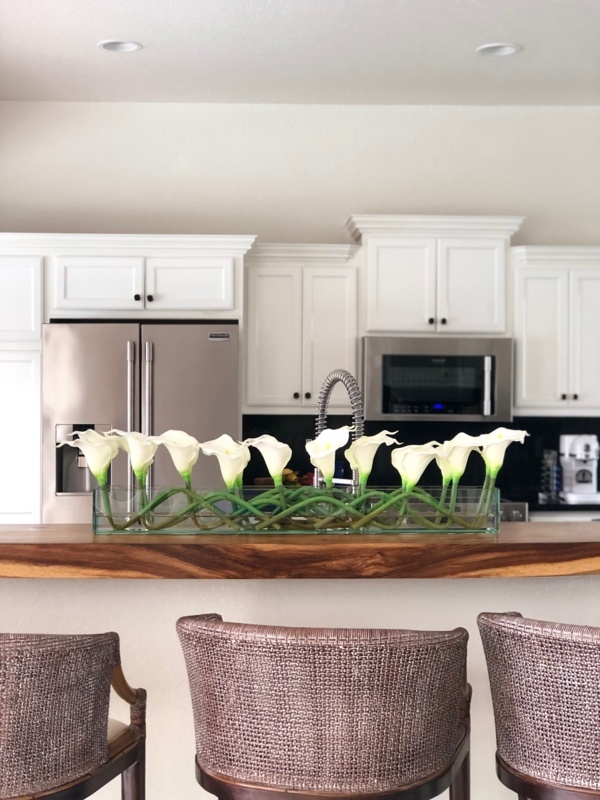 Casa Moderna glass plate planter with mango calla lilies