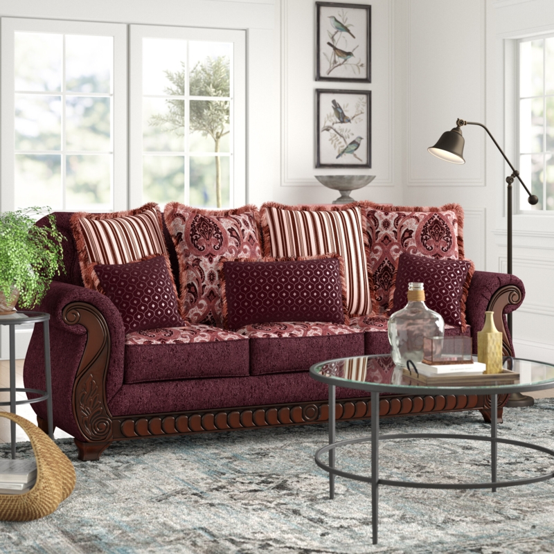 Ornate Dark Brown Sofa with Throw Pillows