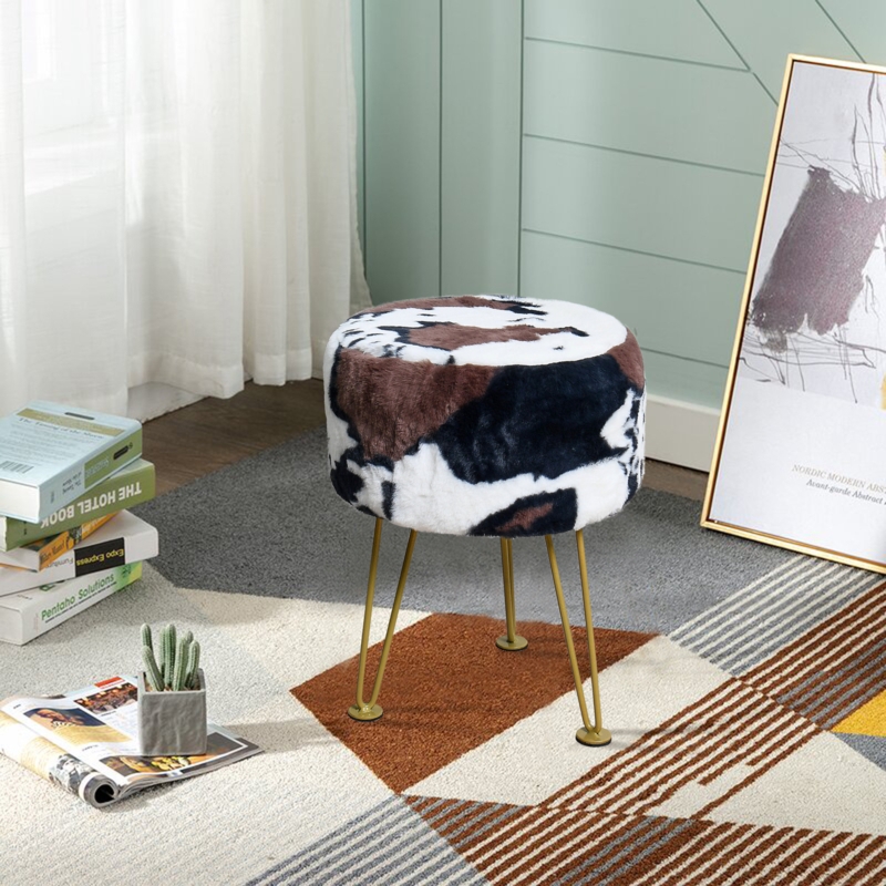 Upscale Ottoman with Cow Print and Gold Legs