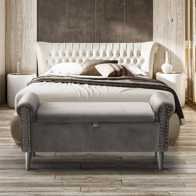 Velvet bench at foot of bed