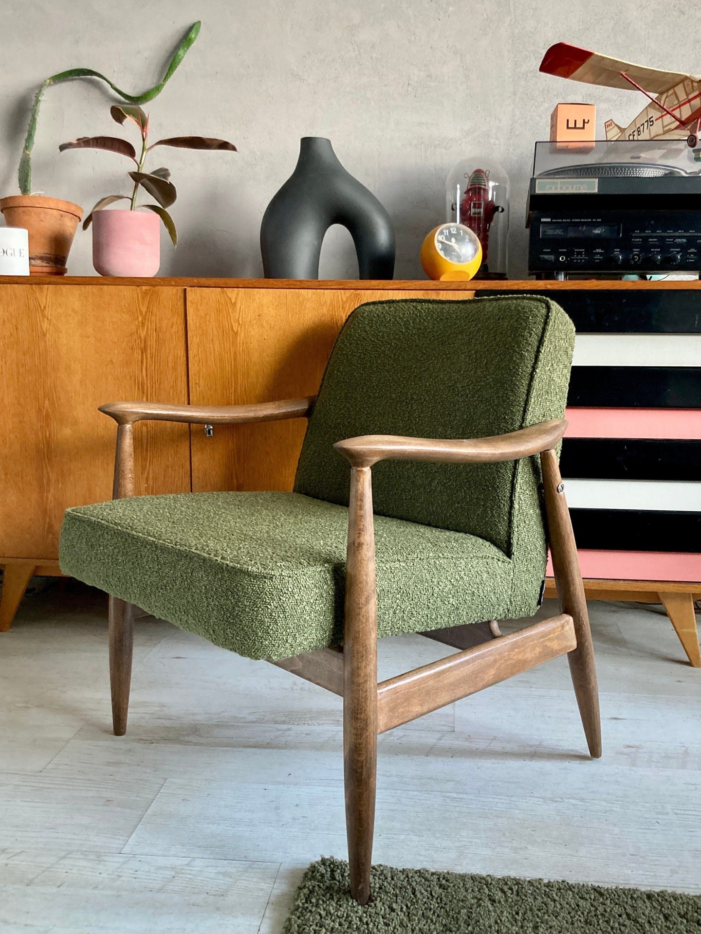 An original vintage polish chair GFM-87 designed in 1965 by Juliusz Kdziorek in a green boucle fabric