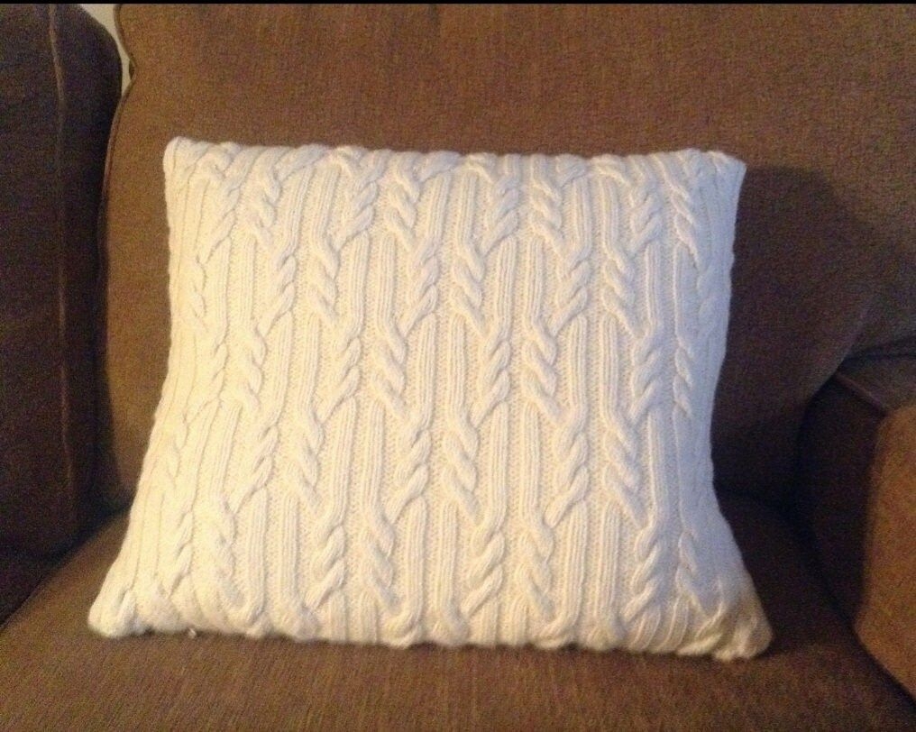 Hand knitted cabled pillow cover