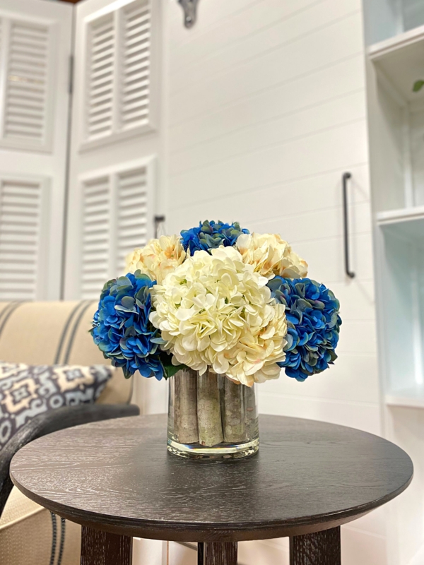 Assorted Hydrangeas Arranged in Glass Vase with Birch Sticks