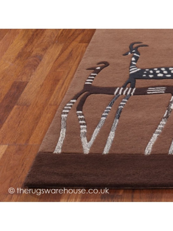 Antelope Patterned Brown Rug on Wooden Floor