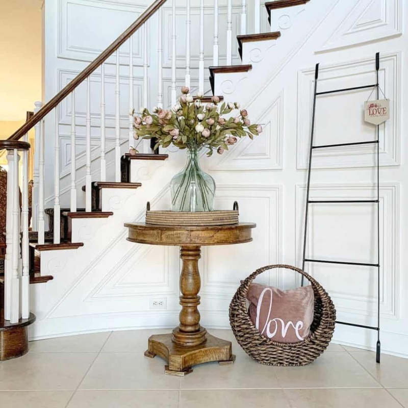Antique Round Wood Entryway Table with Floral Vase
