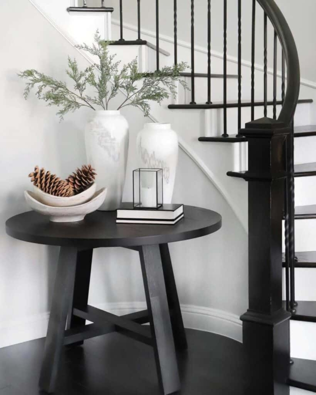 Black Round Entry Table with White Decorative Accents