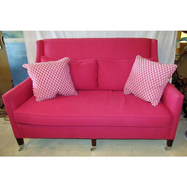 Bold Hot Pink Sofa with Patterned Throw Pillows