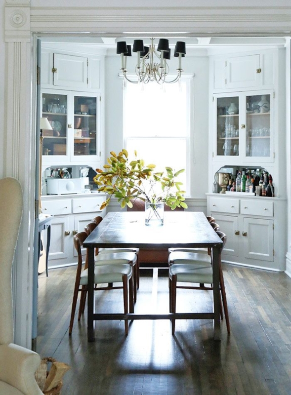 Bright Cottage Dining Room with Corner Cabinets