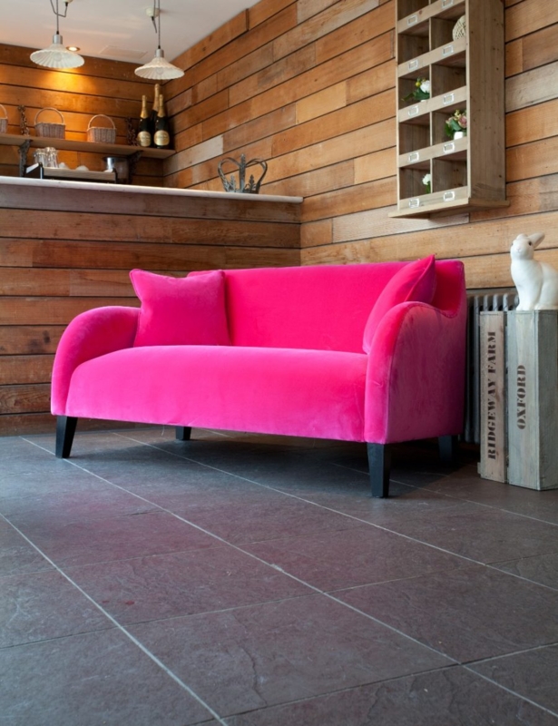 Bright Pink Velvet Sofa in Modern Rustic Setting