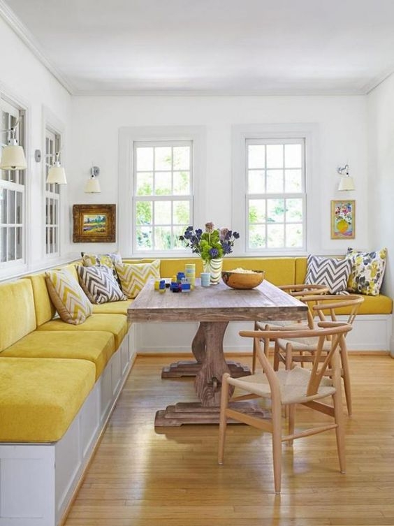 Bright Yellow Banquette Seating with Natural Wood Table
