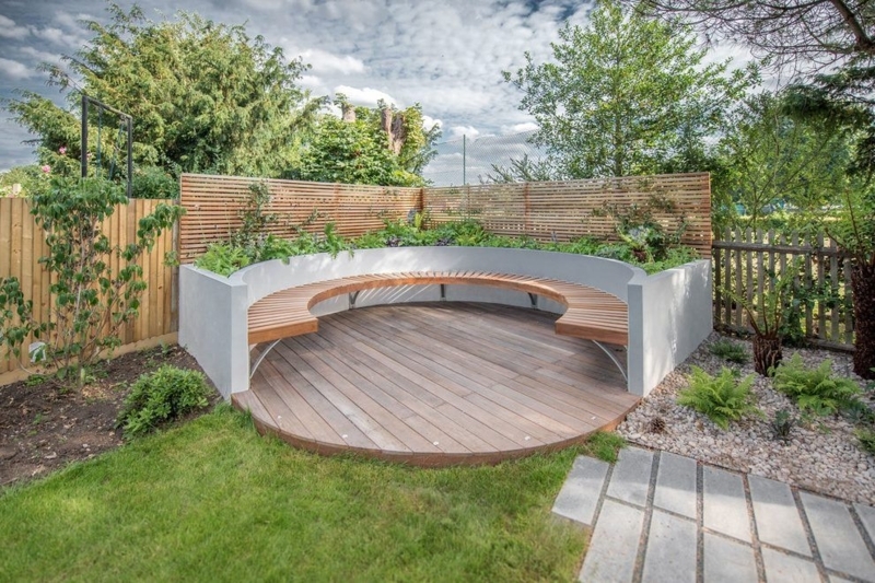 Contemporary Circular Outdoor Seating Area with Curved Bench