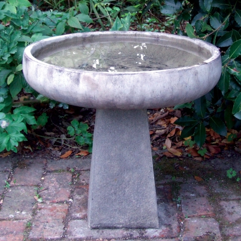 Contemporary Stone Bird Bath on Brick Patio
