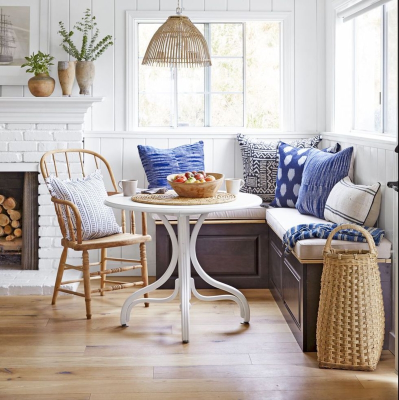 Cozy Corner Banquette Dining Nook with Blue Accents