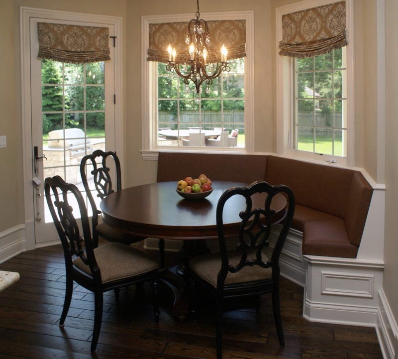 Cozy Curved Banquette Dining Area with Chandelier