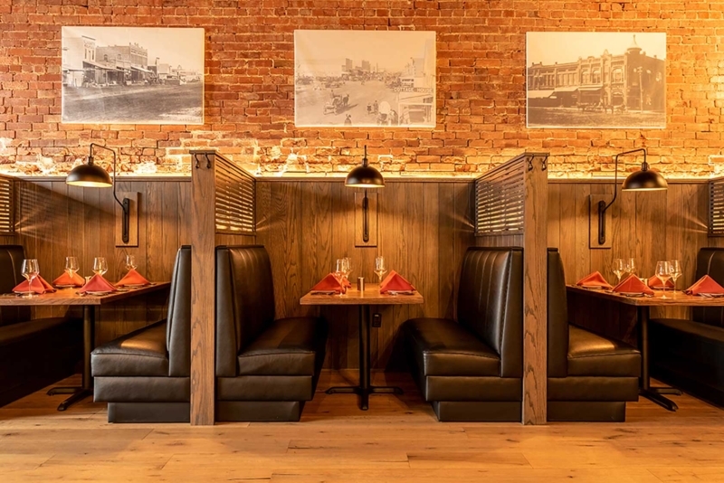 Cozy Leather Restaurant Booths with Exposed Brick Walls