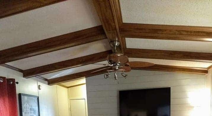 Cozy Mobile Home Ceiling with Gypsum Panels and Wood Beams
