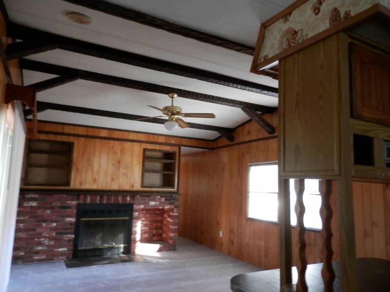 Cozy Mobile Home Living Room with Exposed Ceiling Beams