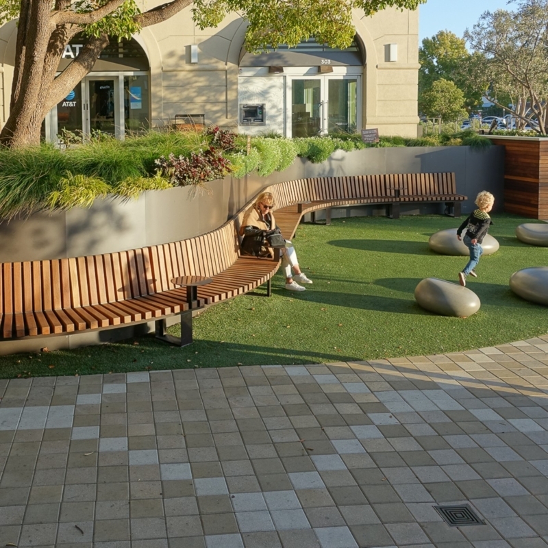 Curved Wooden Benches in Urban Landscape Design