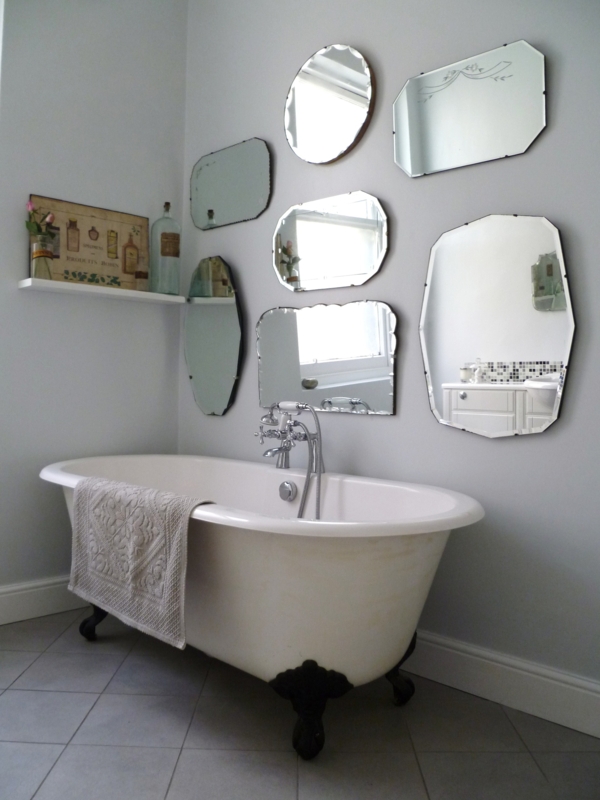 Eclectic Vintage Mirrors Above Classic Clawfoot Tub