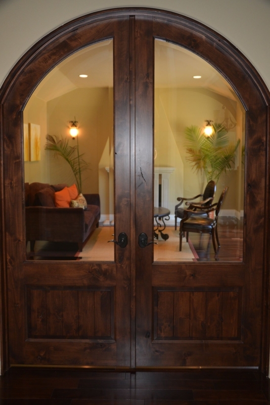 Elegant Arched French Doors with Dark Wood Frame