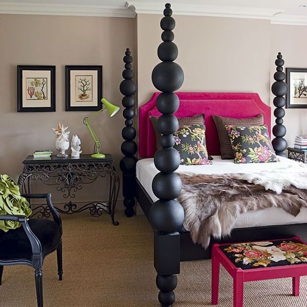 Elegant Black Four Poster Bed with Vibrant Pink Headboard
