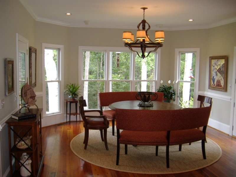 Elegant Curved Bench Seating Around Round Dining Table