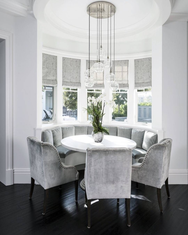 Elegant Curved Dining Nook with Plush Velvet Chairs