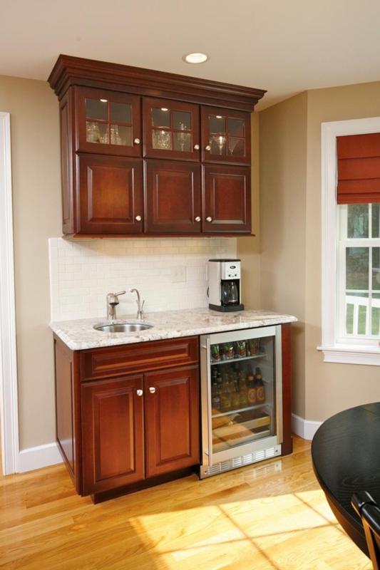 Elegant Dark Wood Wet Bar with Natural Lighting
