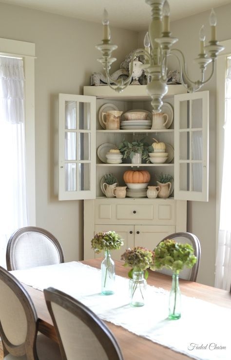 Elegant Farmhouse Dining Room with Vintage Cabinet