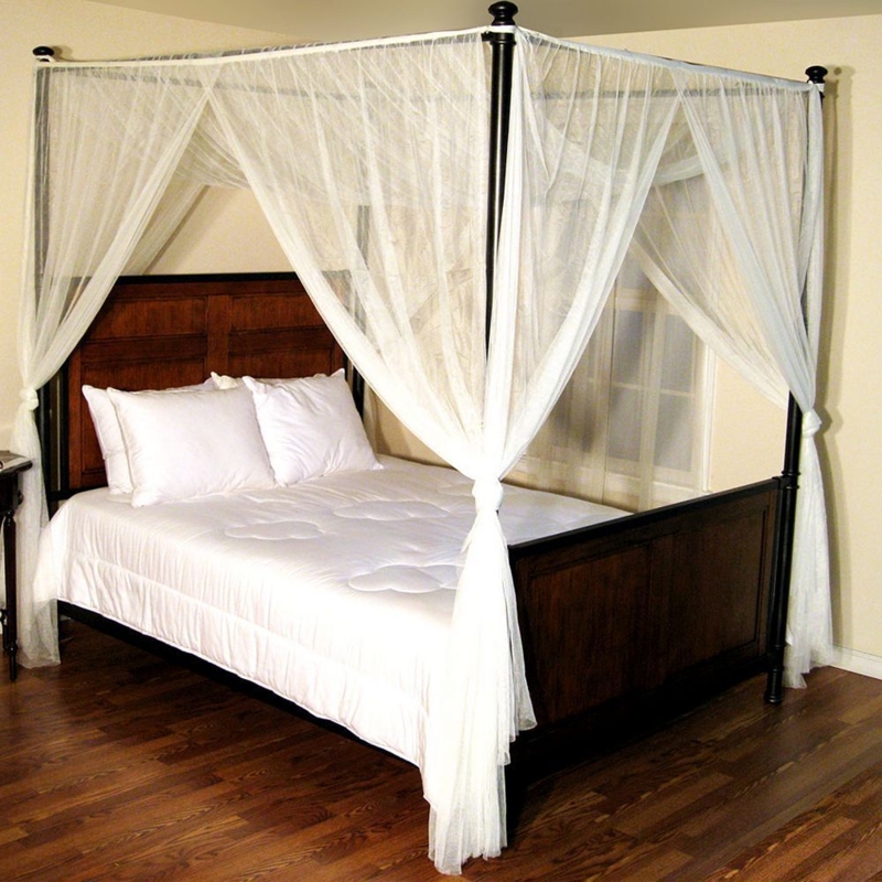 Elegant Four Poster Bed with Sheer Canopy Curtains