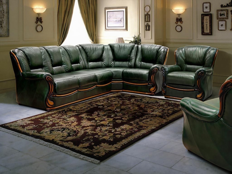 Elegant Green Leather Sofa with Ornate Wood Accents