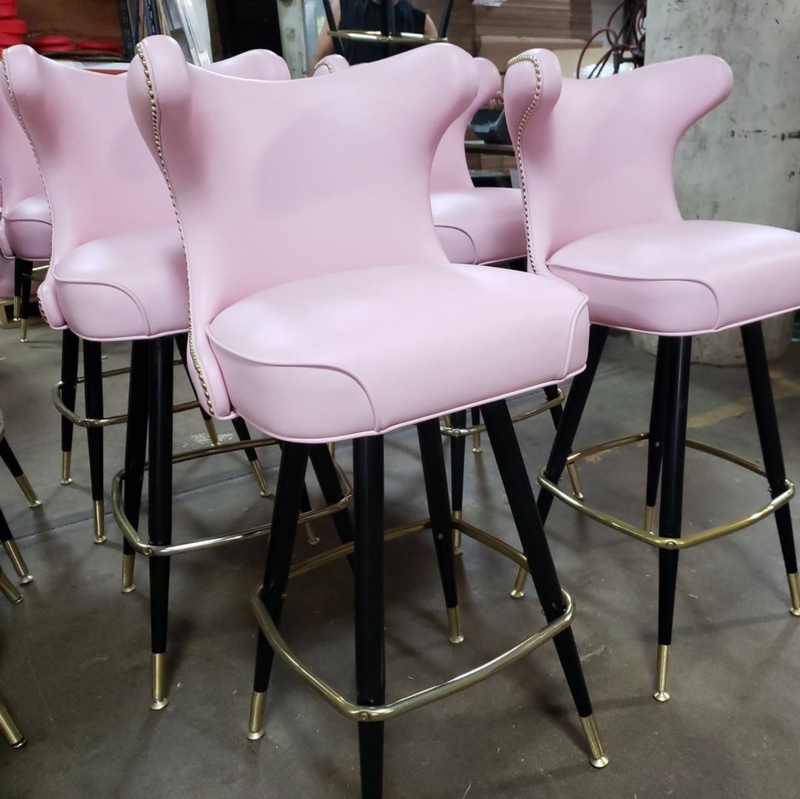 Elegant Pink Bar Stools with Black and Gold Accents