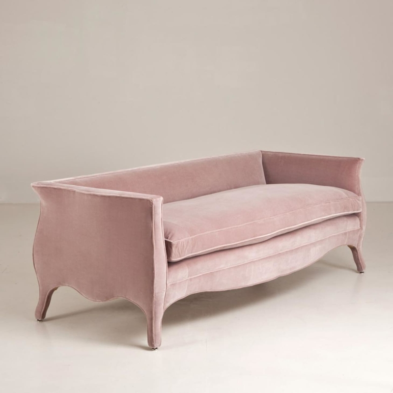 Elegant Pink Velvet Sofa with Curved Silhouette
