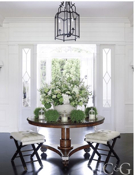 Elegant Round Entry Table with Fresh Floral Arrangement