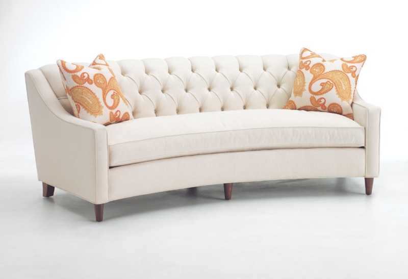 Elegant Small Curved Cream Sofa with Accent Pillows