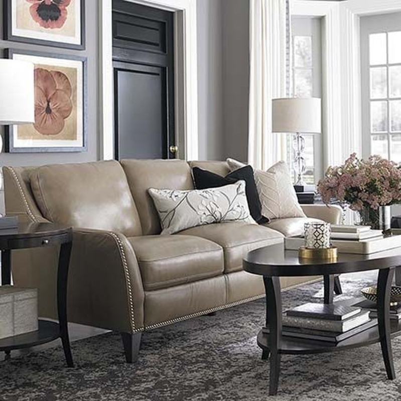 Elegant Taupe Leather Sofa with Black Decor Accents